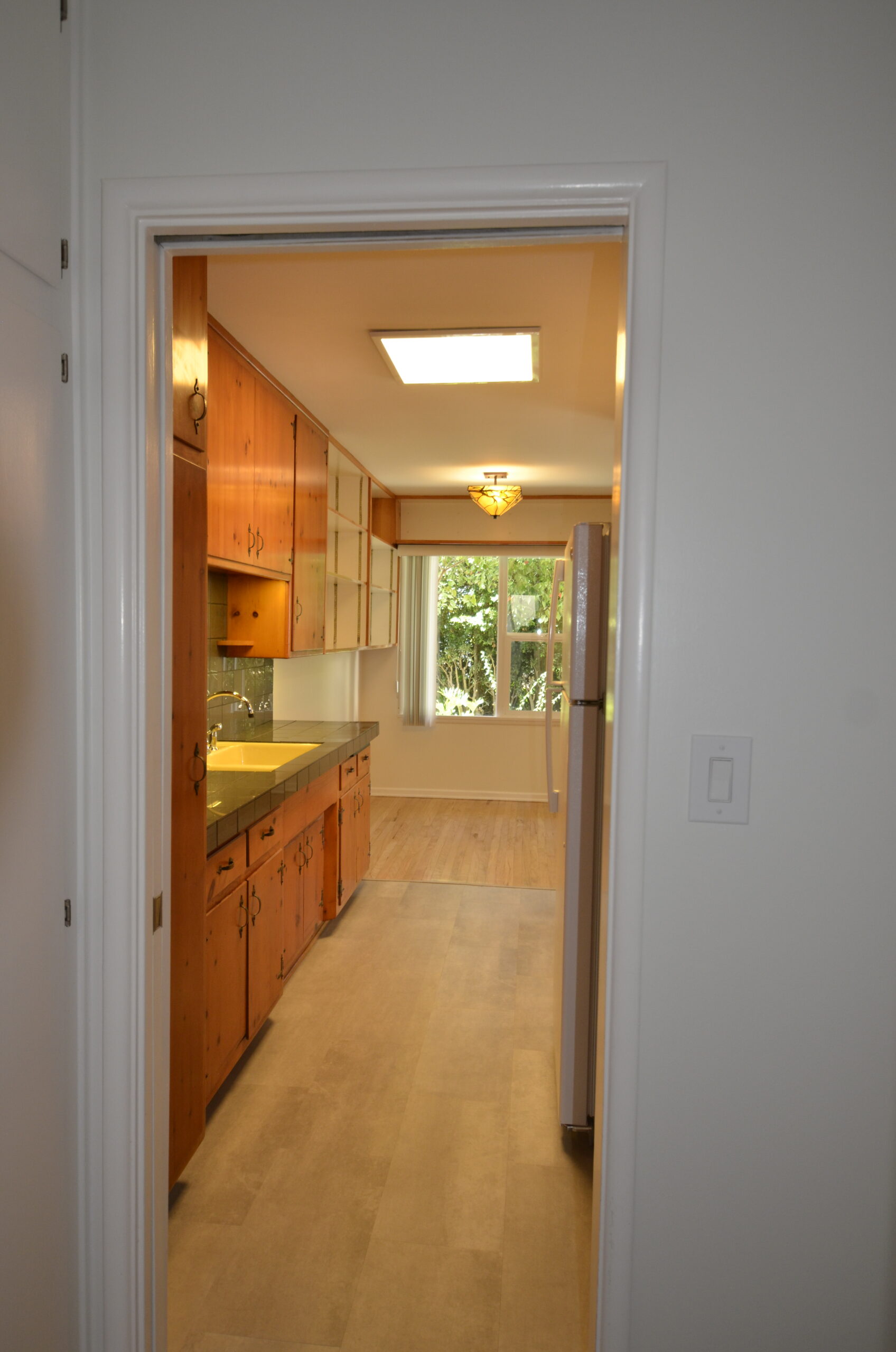 Apt 3 Galley kitchen from hall to bedroom bathroom and extra closet